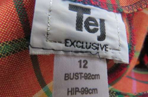 Smart but funky tartan check collarless short sleeve jacket by 'Tej' in size 36/12.