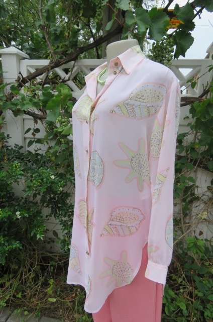 Sheer polyester long sleeve top in pale peach colour. Size 38/14 by 'Giorgio'. Cuffed sleeves.