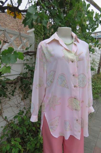 Sheer polyester long sleeve top in pale peach colour. Size 38/14 by 'Giorgio'. Cuffed sleeves.
