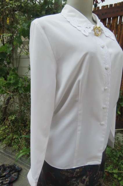 Top of the line white long sleeve top. Button down front with covered buttons size 36/12.