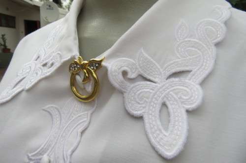 Top of the line white long sleeve top. Button down front with covered buttons size 36/12.