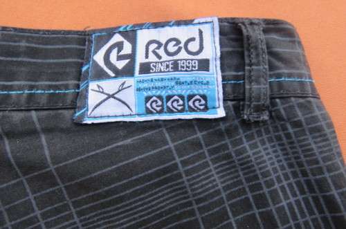 Black and grey check pants by `Red` for boy of 11 to 12 years old. Pockets back and front.