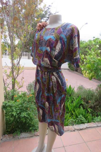 Vintage silky polyester dress in size 38/14. Made by Boutique. Wide cut-on sleeves. Blouson top.