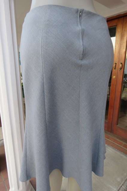 Sassy silvergrey paneled skirt. Only front waistband. Zip at back. By EXACT size 34/10.AS NEW