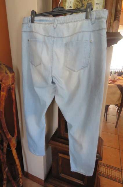 Modern ladies light blue denim jeans with distressed look by 'Donatella' size 46/22.
