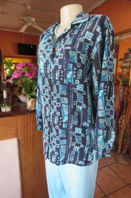 Smart long sleeve navy top with turquoise geometric print size 36/12. Cuffed sleeves.