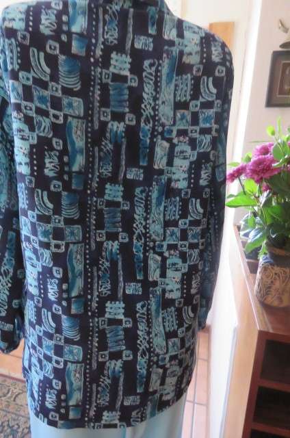 Smart long sleeve navy top with turquoise geometric print size 36/12. Cuffed sleeves.