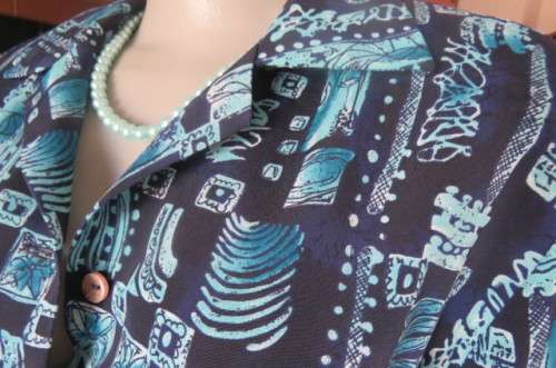 Smart long sleeve navy top with turquoise geometric print size 36/12. Cuffed sleeves.