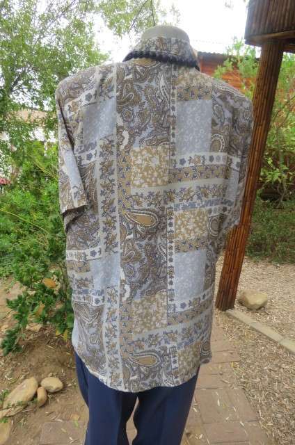 Paisley patterned soft blue, beige, grey and white button down top with open collar size 46/22.