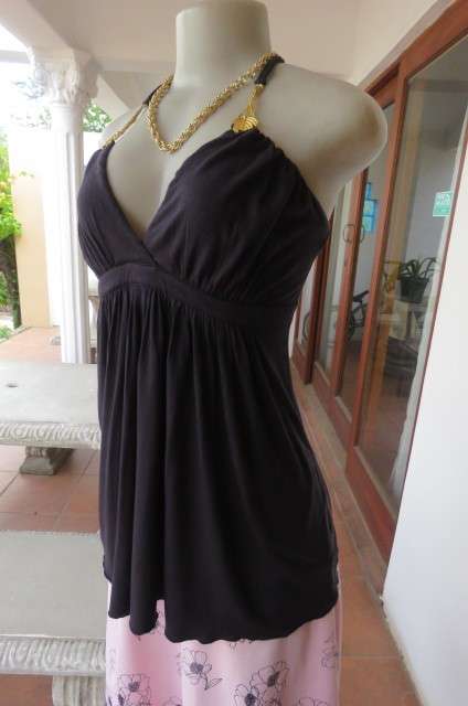 Ultra sexy black halterneck top in size 36/12. Gilded attachment on straps by 'Eringi'.