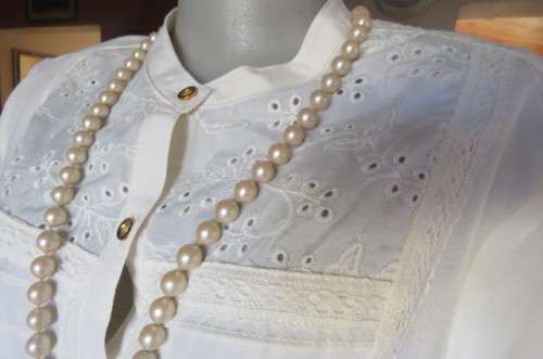 Top of the line rich cream short sleeve top by 'Donatella' size 42/18. As new