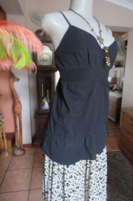 Cute black strappy top with wide elasticated waist by `RT` in size 32/8. Tiestring around hips.