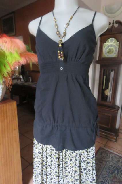 Cute black strappy top with wide elasticated waist by `RT` in size 32/8. Tiestring around hips.
