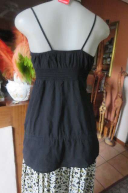 Cute black strappy top with wide elasticated waist by `RT` in size 32/8. Tiestring around hips.
