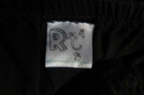 Cute black strappy top with wide elasticated waist by `RT` in size 32/8. Tiestring around hips.