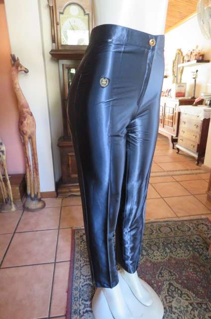 Shiny new navy skinny legged pants by 'Woman Sence' in 100% polyester with satin look size 33/9.