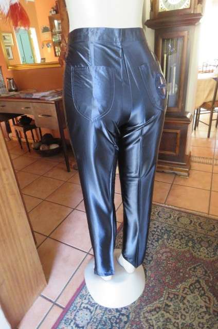 Shiny new navy skinny legged pants by 'Woman Sence' in 100% polyester with satin look size 33/9.