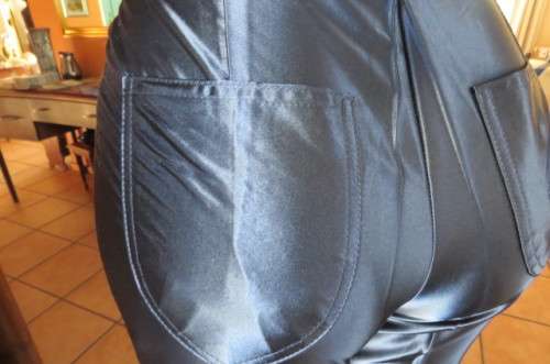 Shiny new navy skinny legged pants by 'Woman Sence' in 100% polyester with satin look size 33/9.