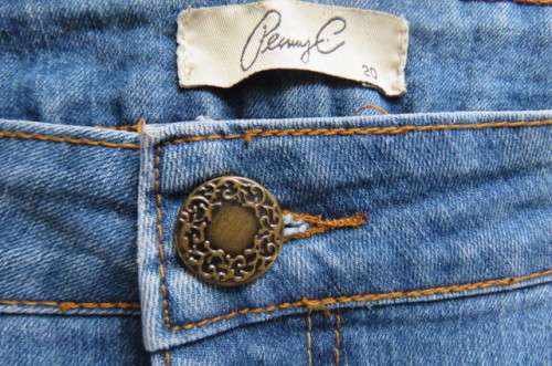 'Penny C' blue denim jeans in size 44/20. In polycotton stretch fabric. Pockets back and front.