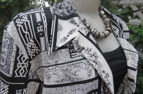 Prominent geometric printed monochrome long sleeve blouse by 'Scotts' in size 42/18.