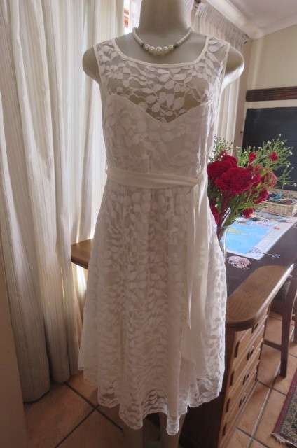 Very smart maternity dress by 'du date' in size 36/12. In very light cream cotton/nylon lace