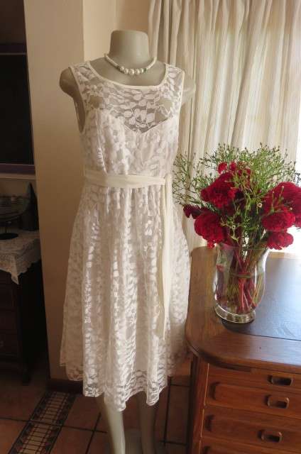 Very smart maternity dress by 'du date' in size 36/12. In very light cream cotton/nylon lace