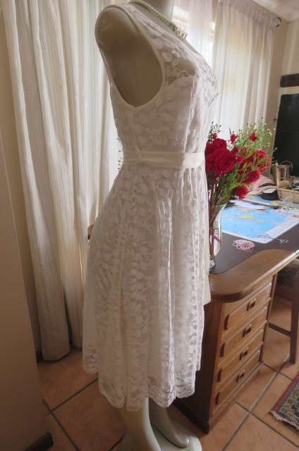 Very smart maternity dress by 'du date' in size 36/12. In very light cream cotton/nylon lace