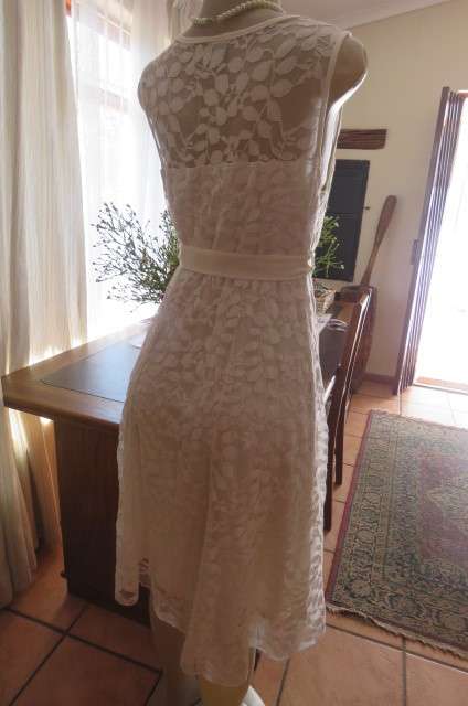 Very smart maternity dress by 'du date' in size 36/12. In very light cream cotton/nylon lace