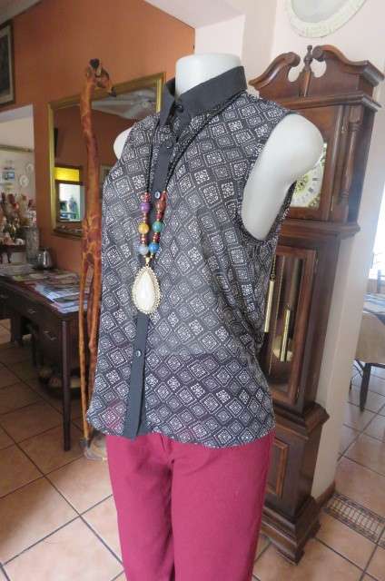 Cheeky patterned monochrome sleeveless top with black collar by `Audacity` in size 38/14. As new.