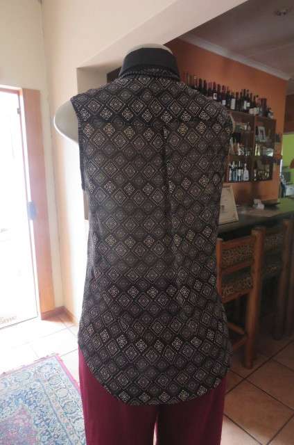 Cheeky patterned monochrome sleeveless top with black collar by `Audacity` in size 38/14. As new.