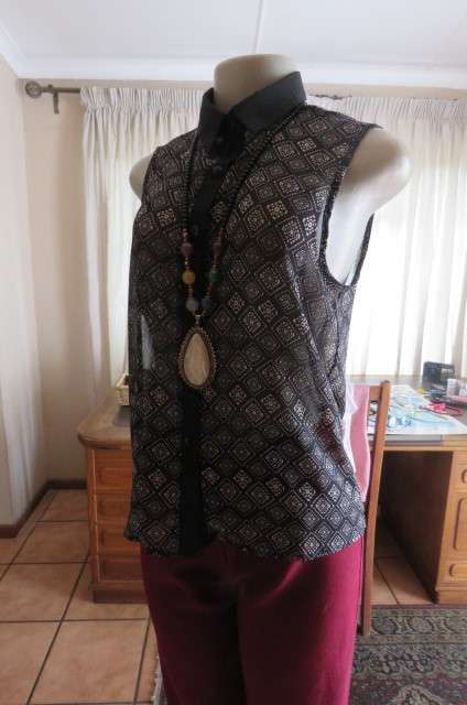 Cheeky patterned monochrome sleeveless top with black collar by `Audacity` in size 38/14. As new.