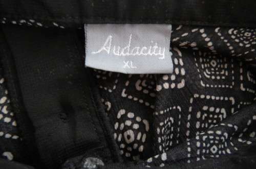 Cheeky patterned monochrome sleeveless top with black collar by `Audacity` in size 38/14. As new.