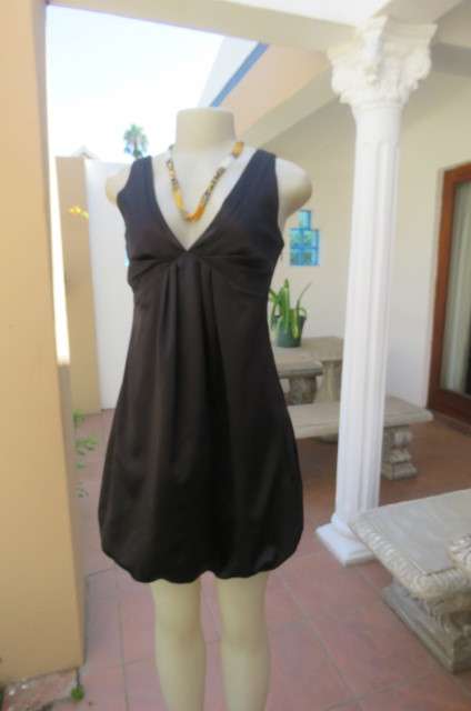 Sexy little black balloon dress by `New Look`size 32/8.Pleat at neckline back.Low V front.As new