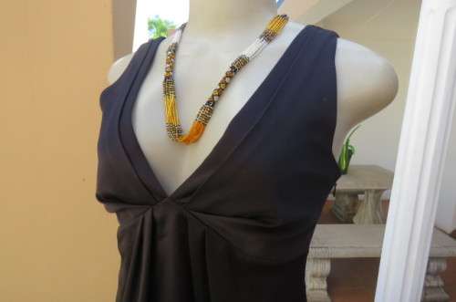 Sexy little black balloon dress by `New Look`size 32/8.Pleat at neckline back.Low V front.As new