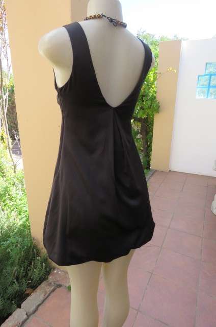 Sexy little black balloon dress by `New Look`size 32/8.Pleat at neckline back.Low V front.As new