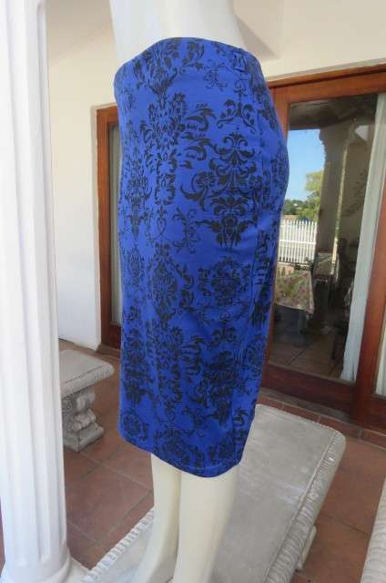 Bodycon skirt in royal blue with black baroque print in poly stretch.By`Insync Formal` size 34/10.
