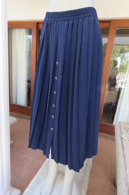 Fabulous navy permanent pleated skirt by 'Woolworths' in size 36/12. Knife pleated.