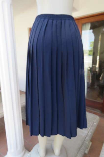 Fabulous navy permanent pleated skirt by 'Woolworths' in size 36/12. Knife pleated.