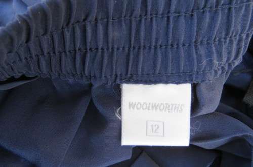 Fabulous navy permanent pleated skirt by 'Woolworths' in size 36/12. Knife pleated.