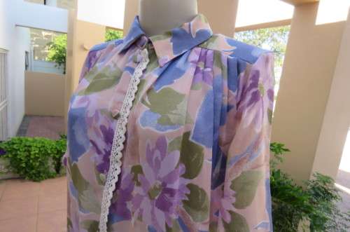 Smart dull pink with purple, blue and green floral pattern top size 34/10. Short sleeves.