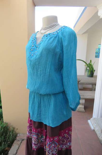 Long jade colour vertically creased with wide elasticated waist size 40/16 by 'Ella'.