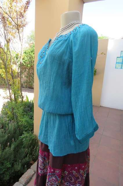 Long jade colour vertically creased with wide elasticated waist size 40/16 by 'Ella'.