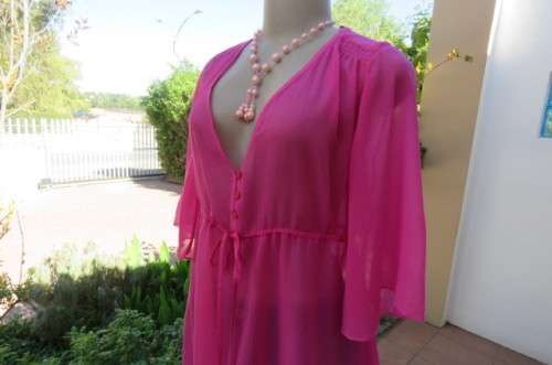 Beautiful long sheer polyester hot pink top  with bell sleeves. Size 40/16 by FU. Tiestring in waist