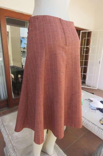Totally on trend golden brick colour paneled skirt in kick out style. Textured polycotton size 36/12