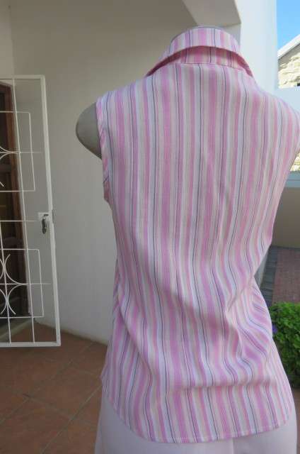 Cute pink and cream vertical striped sleeveless top in size 32/8 by INSYNC. Two dummy pockets.
