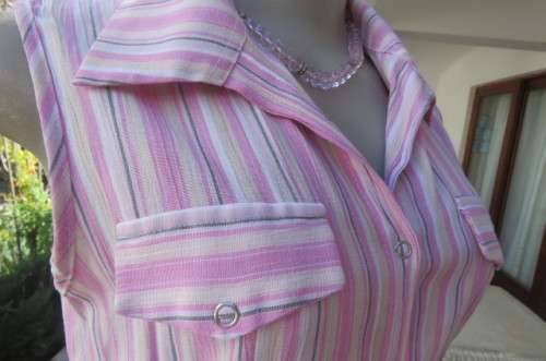 Cute pink and cream vertical striped sleeveless top in size 32/8 by INSYNC. Two dummy pockets.