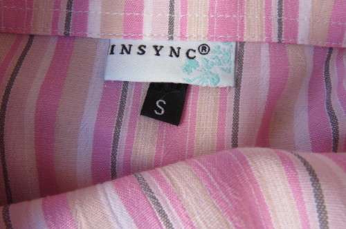 Cute pink and cream vertical striped sleeveless top in size 32/8 by INSYNC. Two dummy pockets.