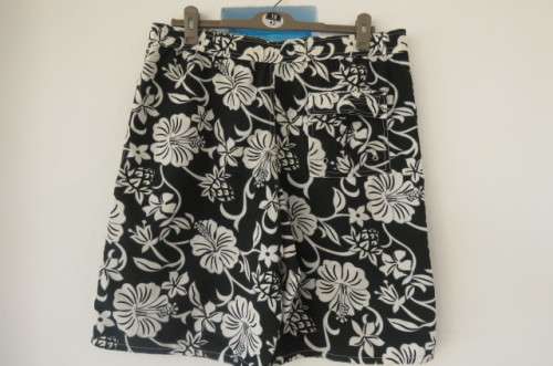 Men's black,white and grey floral TAMARAMA surf shorts in size Large. In 100% polyester fabric.