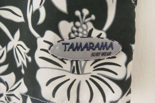 Men's black,white and grey floral TAMARAMA surf shorts in size Large. In 100% polyester fabric.