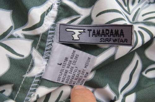 Men's black,white and grey floral TAMARAMA surf shorts in size Large. In 100% polyester fabric.